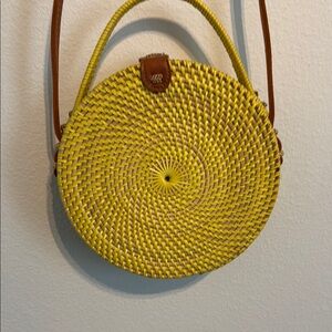 Yellow Woven Round Straw Paurse with Snap Closure